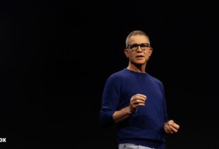 Roblox CEO and Founder David Baszucki speaking at the Roblox Developers Conference black background